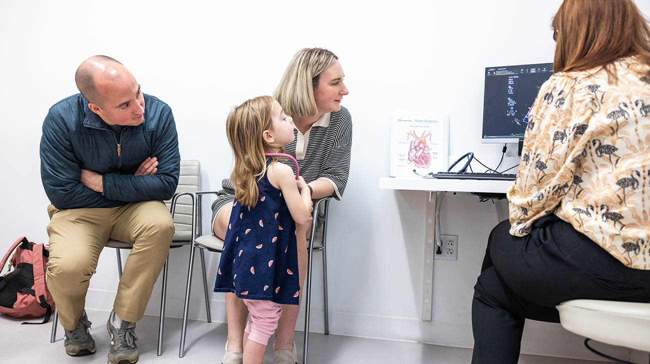 Christan, Ella, and Luke during a follow up appointment with pediatric cardiologist Dr. Holly Nadorlik.